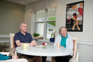 Independent living residents talking over a meal at Scott-Farrar in Peterborough